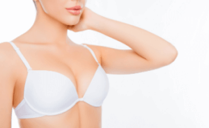 Female with a white bra on after breast enlargement in Manchester
